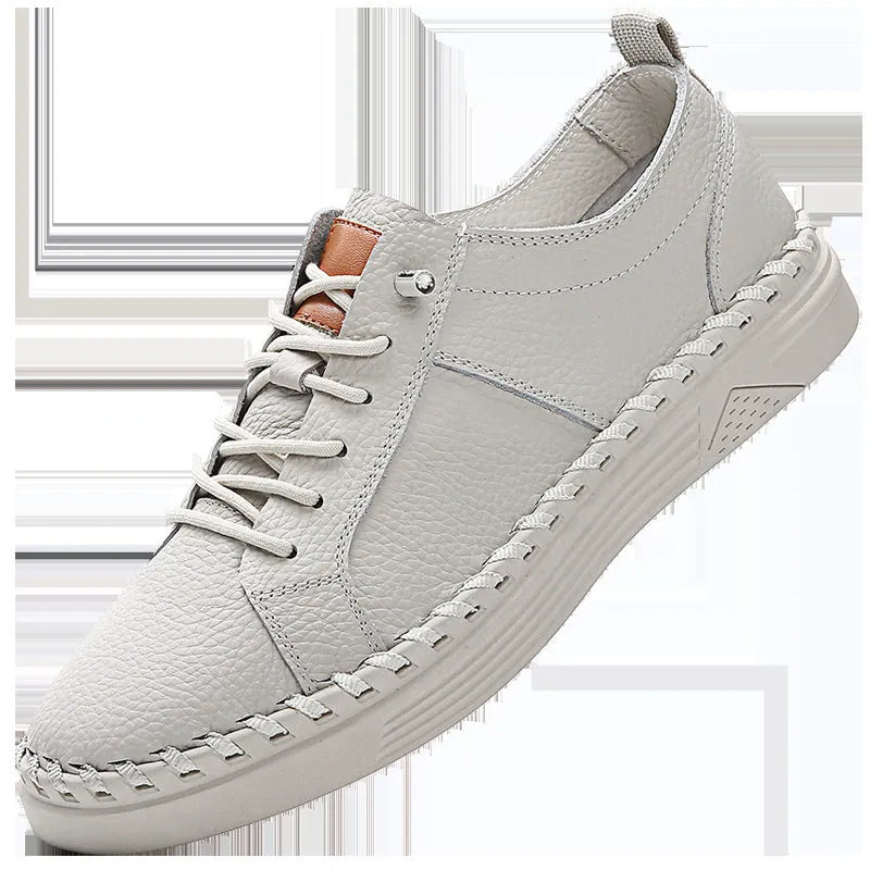 Men's beige casual leather sneakers with mesh lining and round toe stitching detail.