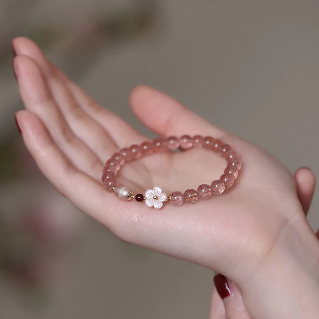 Strawberry quartz crystal bracelet with peach blossom flower charm design on adjustable chain