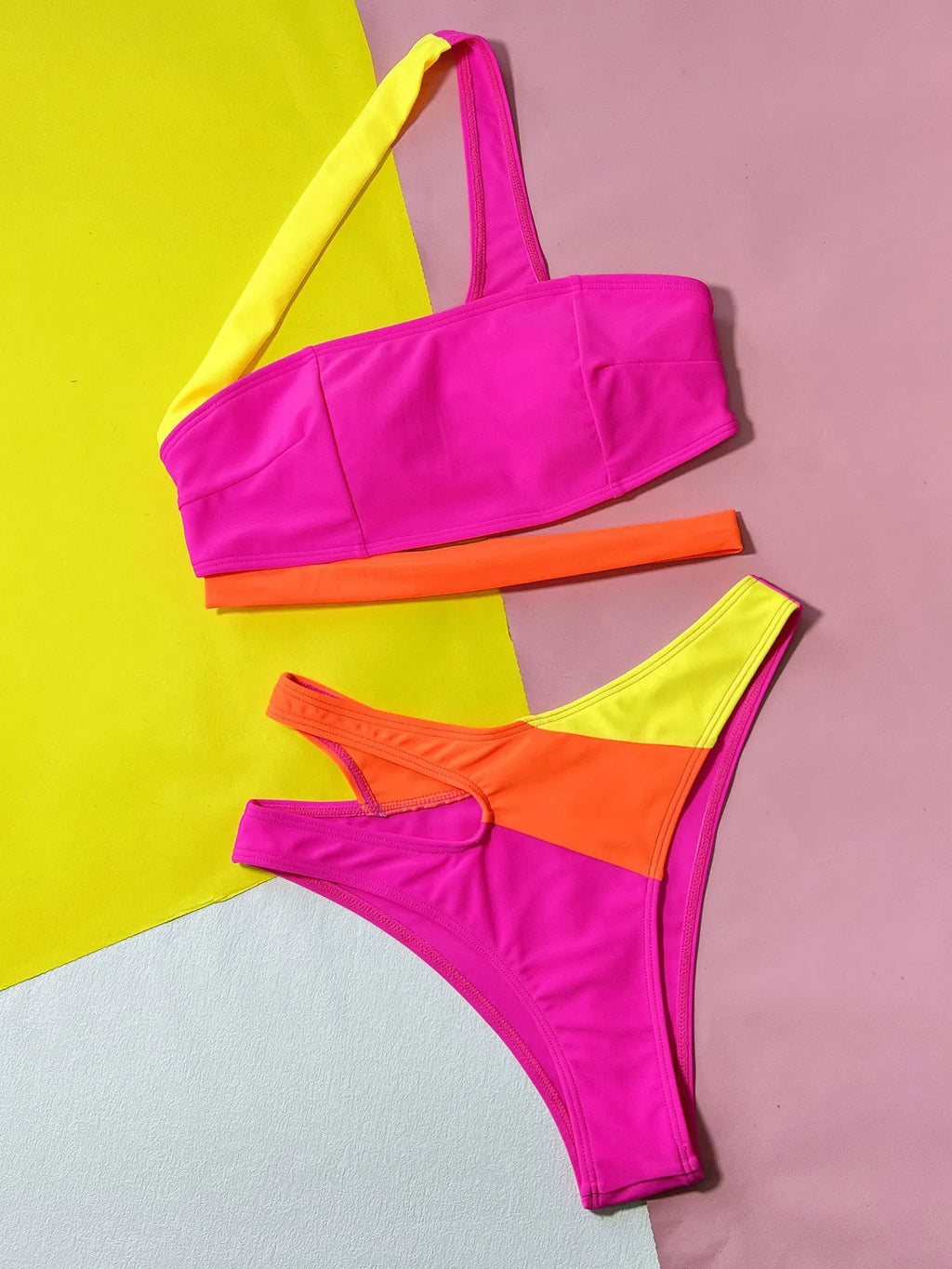 Rose red women's bikini with hollow contrast colour split design on a two-piece swimsuit set.