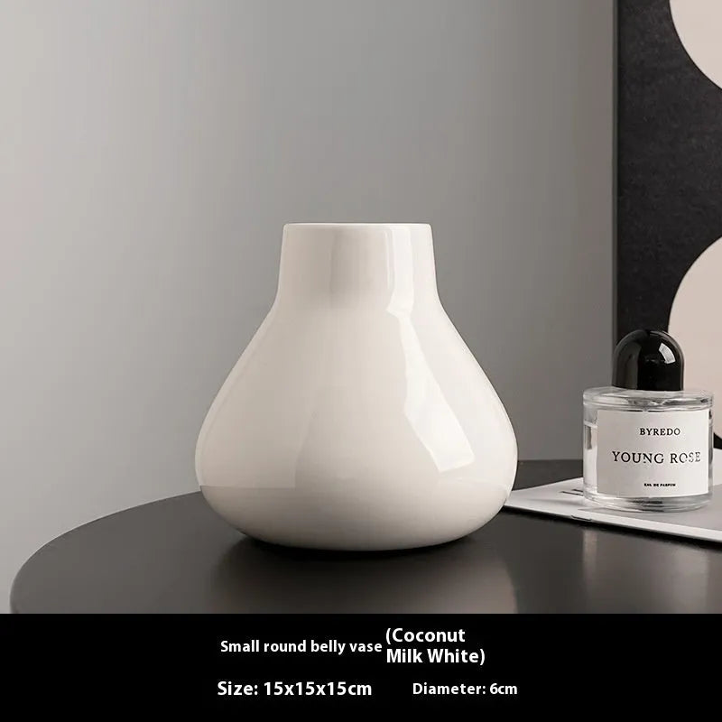 Round belly ceramic vase in black or white with optional artificial flowers arrangement