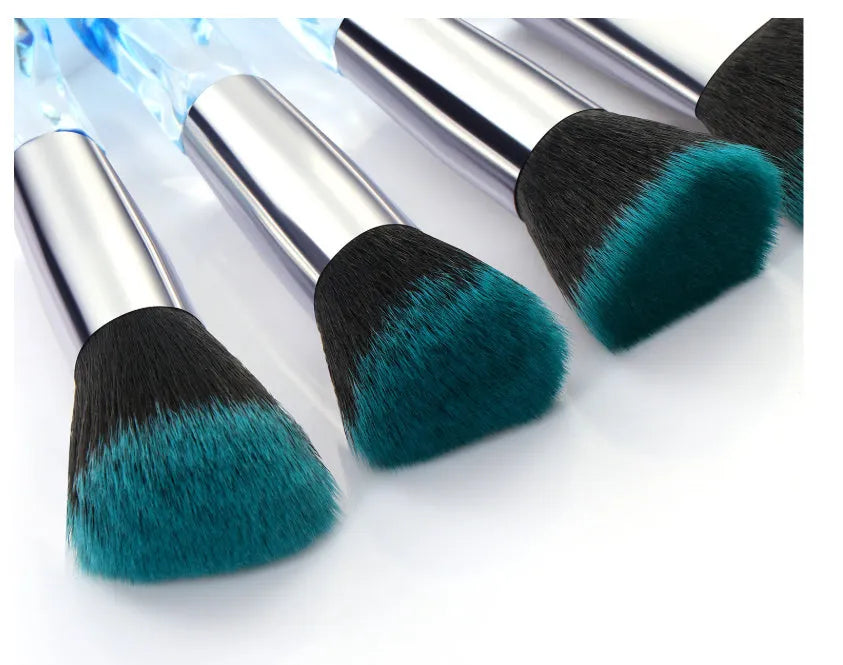 10 clear crystal handle foundation brushes with diamond shank design and black bristles.