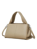 Women's brown retro texture leather messenger bag with a double shoulder strap shown on a table.