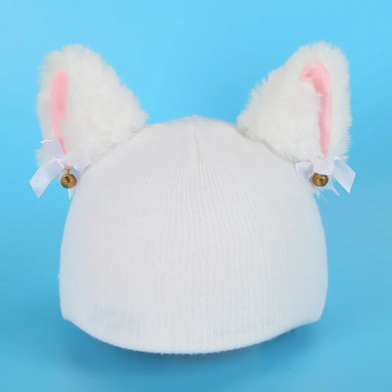 Soft plush cartoon character cover on a motorcycle helmet, showing size M and decorative ear sections.