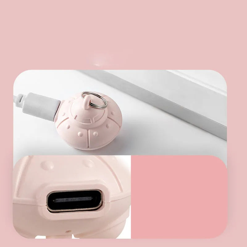 Green or pink cat collar laser toy with compact 3cm plastic housing showing USB charging port