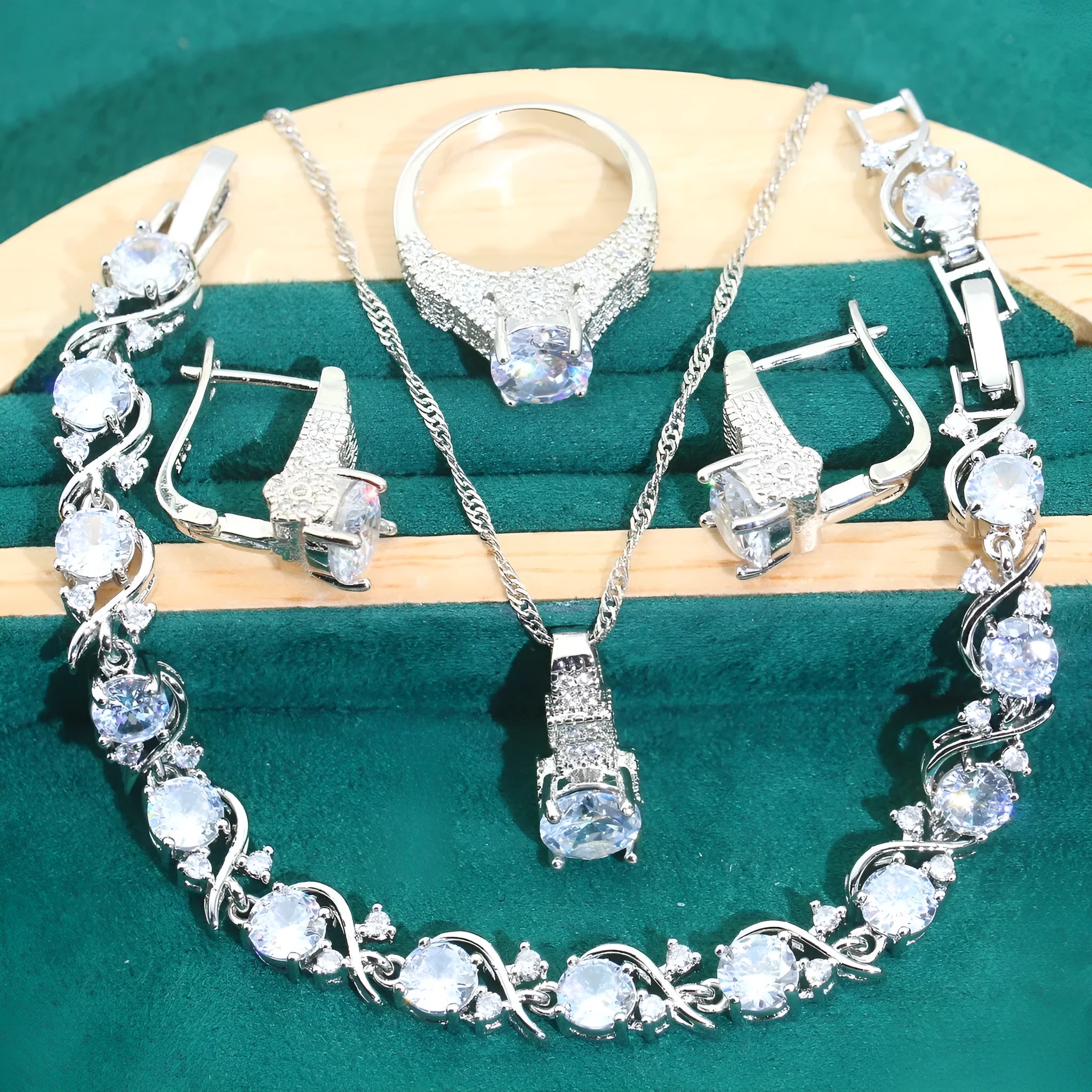 Bridal zircon jewellery four-piece set showing necklace, bracelet, earrings and ring with water wave chain