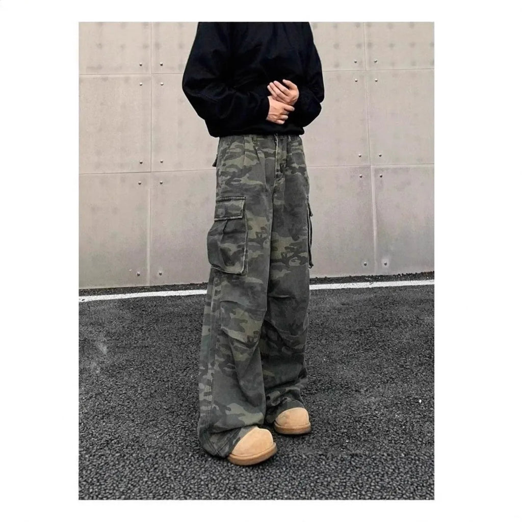 Cotton blend cargo trousers with washed camouflage print and multiple pockets.