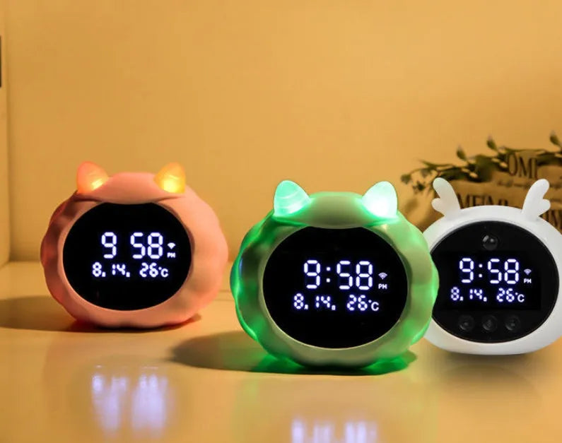 Smart alarm clock with voice dialogue and motion sensor in animal design with luminous display