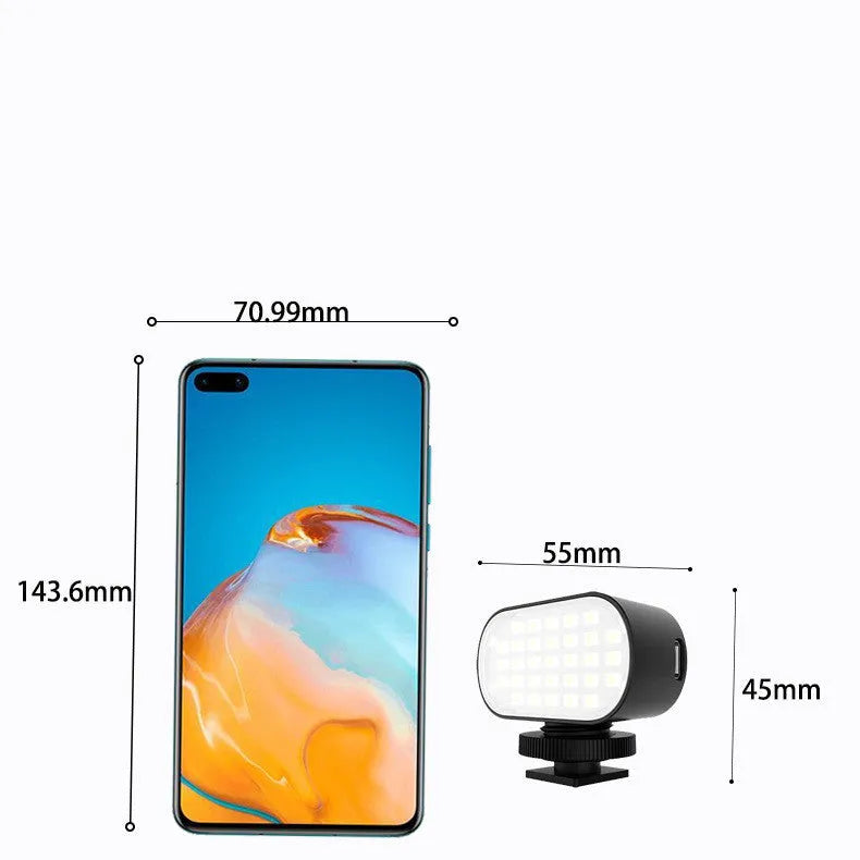 ST-30 black handheld mobile phone fill light with digital display, cold shoe mount, and colour palettes.