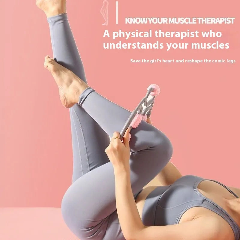 Handheld leg massager roller with multiple wheels in pink or purple on a table.