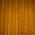 Copper curtain style LED string Christmas lights with USB plug, shown in warm white colour