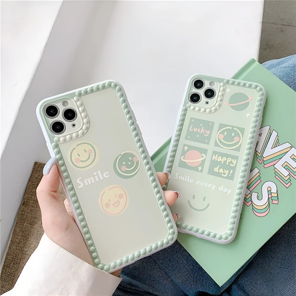 Geometric smiley face TPU iPhone case with polka dot frame on iPhone