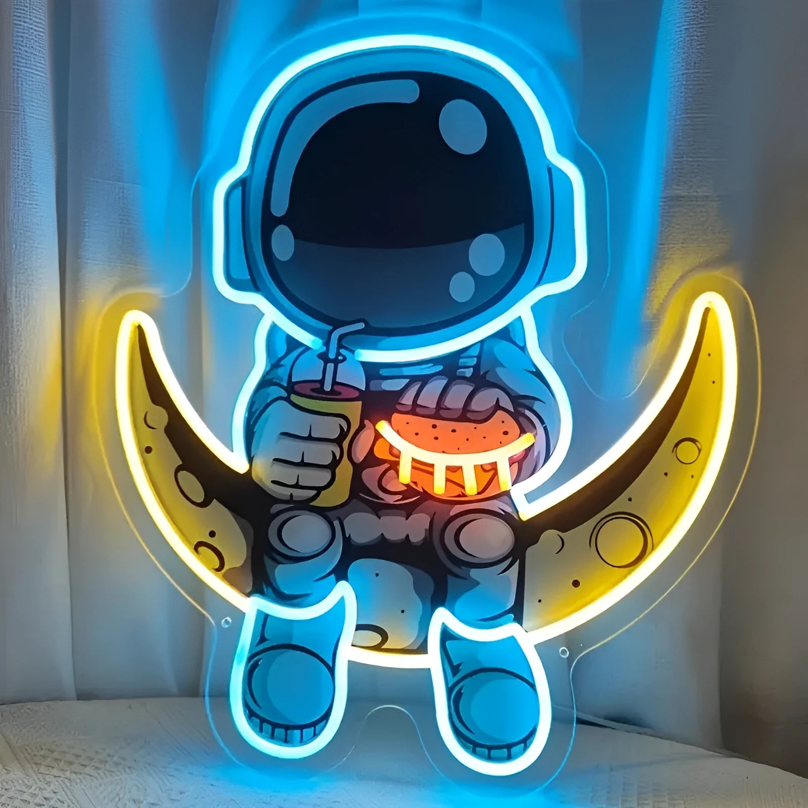 Blue Astronaut shaped LED neon light mounted on a wall, powered by USB.