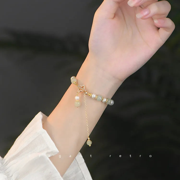 Women's Hetian jade bracelet with pearl pendant and electroplated gold alloy metal in Chinese style