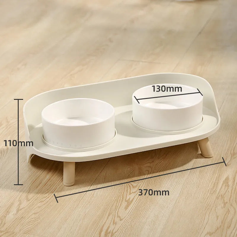 Green adjustable tilted pet feeder with two bowls for cats and dogs