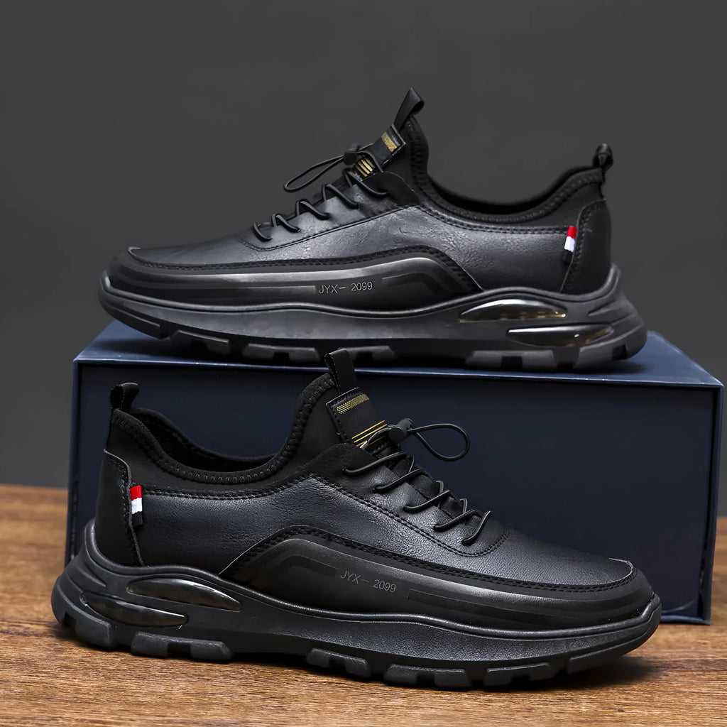 Men's black fleece-lined waterproof sneakers with a round toe and low-top design on a rubber sole.