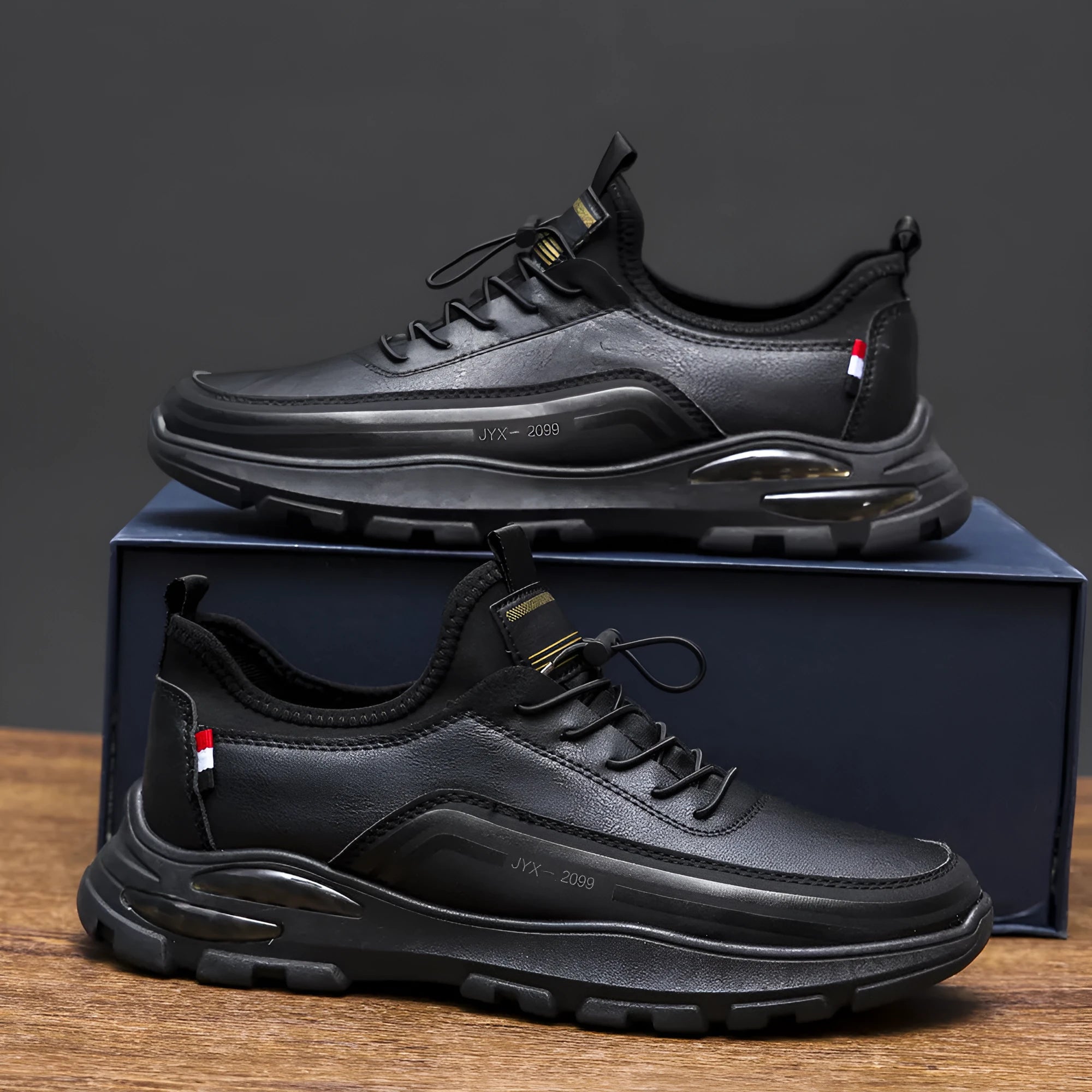 Men's black fleece-lined waterproof sneakers with a round toe and low-top design on a rubber sole.