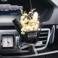 Dried flower car air freshener with natural aroma slices mounted on vehicle air conditioning vent