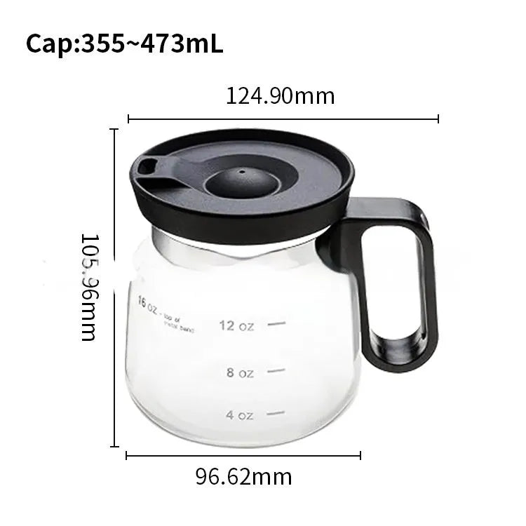 Transparent borosilicate glass stovetop coffee maker with black silicone cover on a hob.
