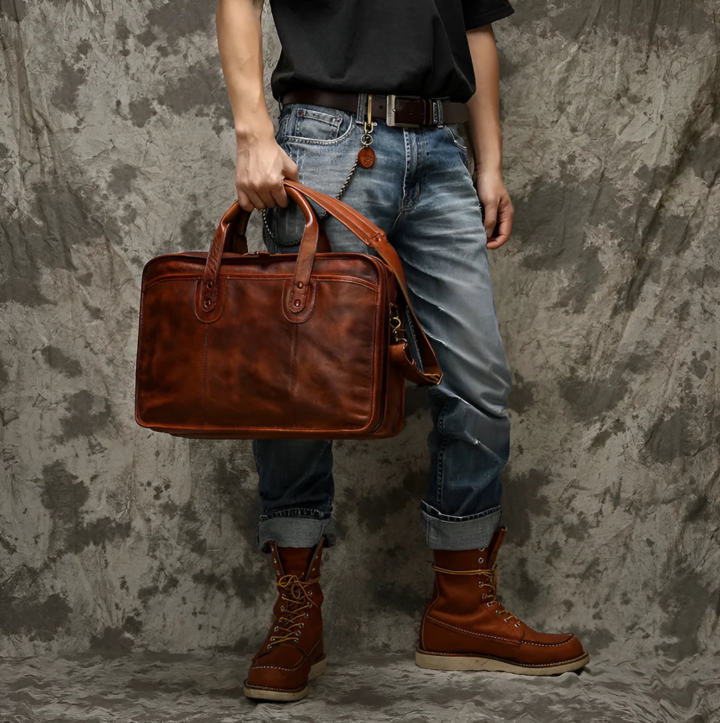 Black top grain cowhide leather men's briefcase showing its horizontal square shape and internal organiser pockets.