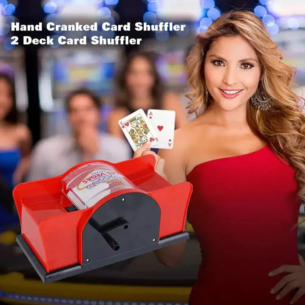 Black and red manual hand-crank card shuffler machine for casino games on a table.