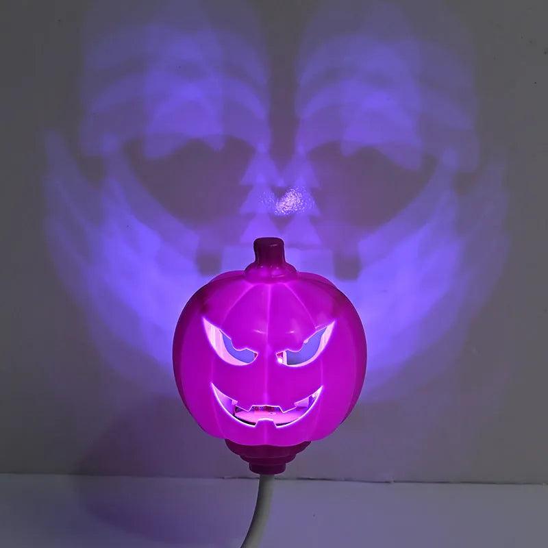 Plastic pumpkin lamp with USB power cable showing yellow or purple light options