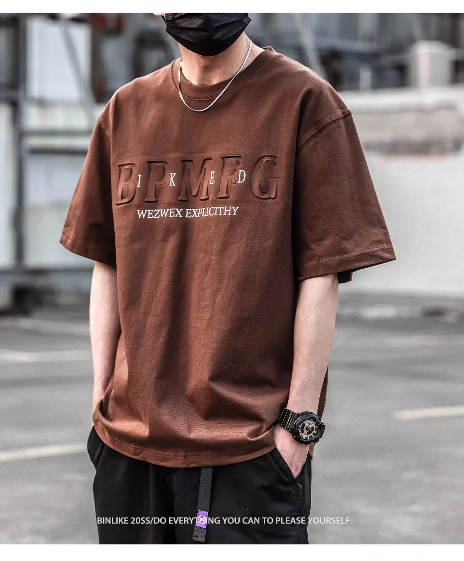 Men's short sleeve simple printed top in combed cotton available in brown, black, and white