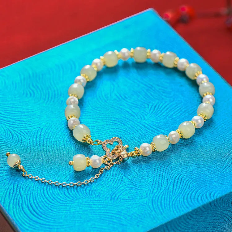 Women's Hetian jade bracelet with pearl pendant and electroplated gold alloy metal in Chinese style