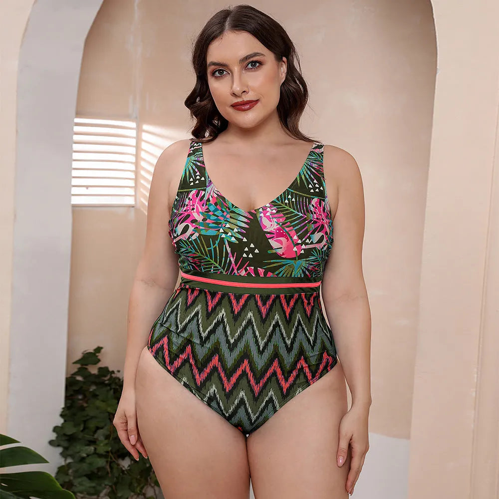Women's blue printed one-piece swimsuit with spaghetti straps and a striped vest design.