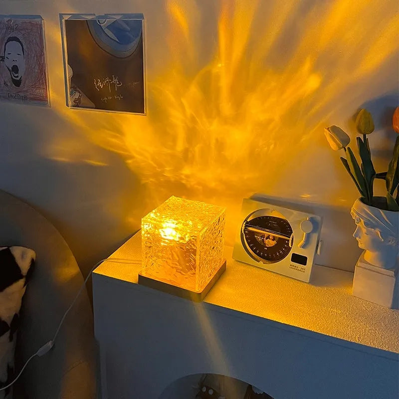 LED water ripple night light with USB cable and remote control creating rotating projection on wall