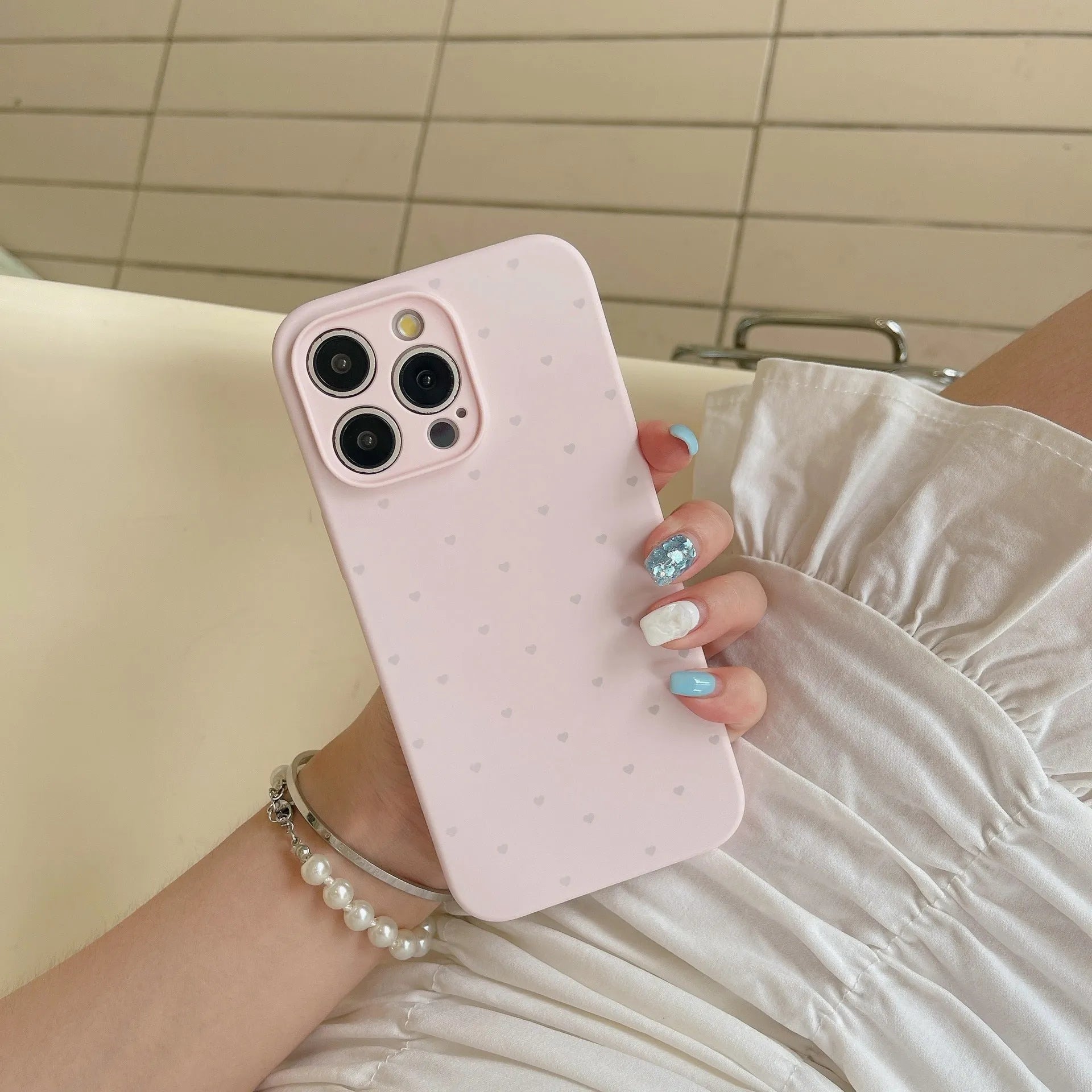 Liquid silicone phone case with love heart design in grass purple for iPhone 13, showing all-inclusive fit