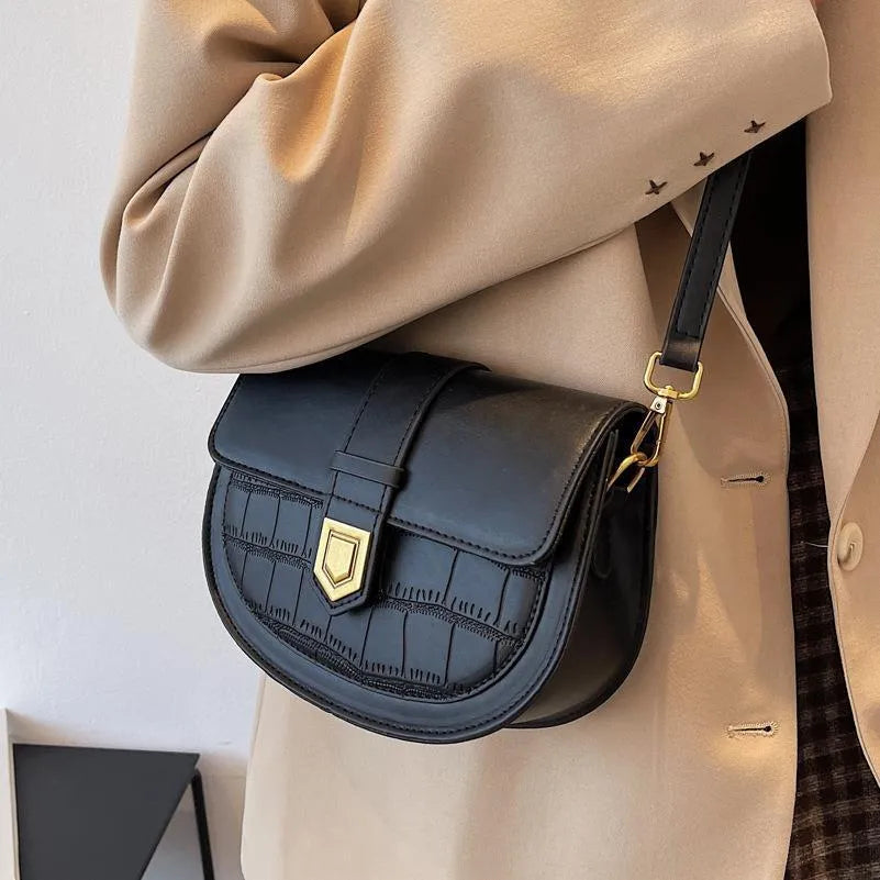 French one shoulder saddle bag for women with lock and stone pattern, available in beige