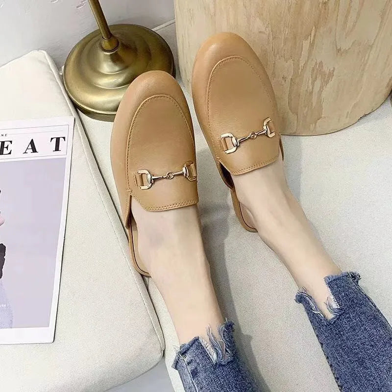 Women's PVC closed-toe half slipper with a buckle, shown in milky white colour.