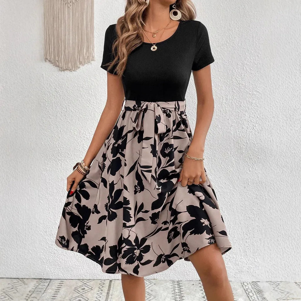 Women's khaki casual dress with plant print, A-line skirt, lace-up detail, and regular sleeves.