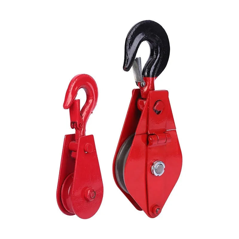 Red industrial lifting pulley with a safety latch on the forged steel hook.