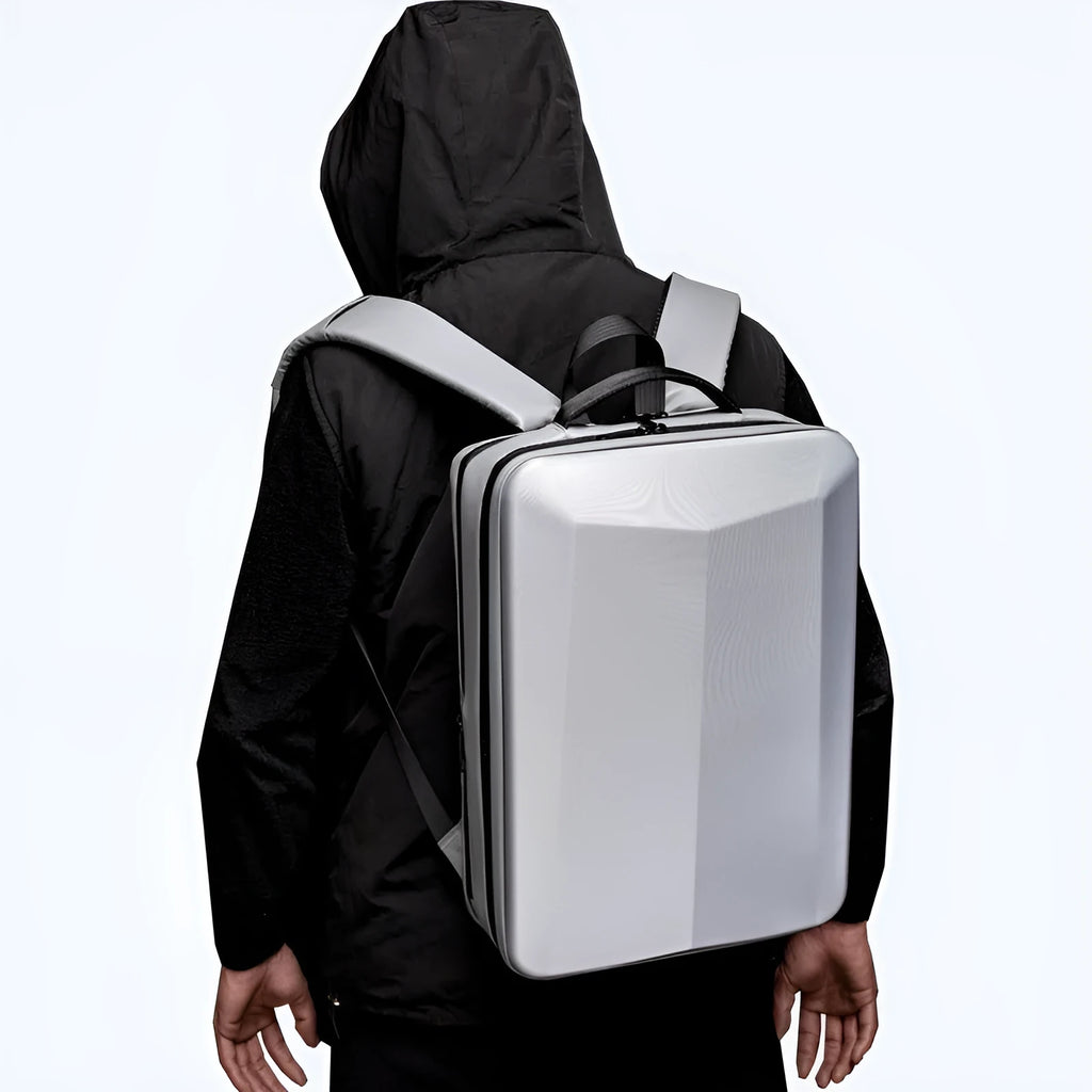 Waterproof black and silver white business backpack with curved shoulder straps and ABS PC frame.
