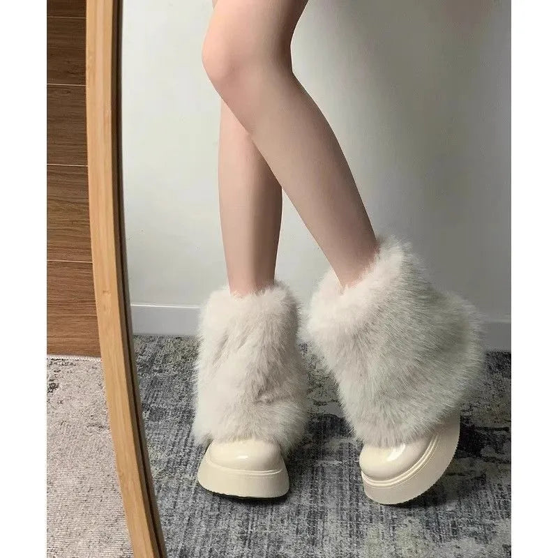 Women's black artificial plush low-top snow boots with a round toe and waterproof rubber sole.