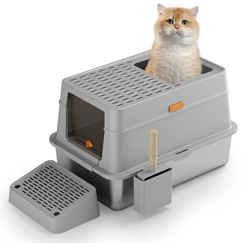 Grey enclosed cat litter box with a foot pedal open, showing the stainless steel dustbin inside.