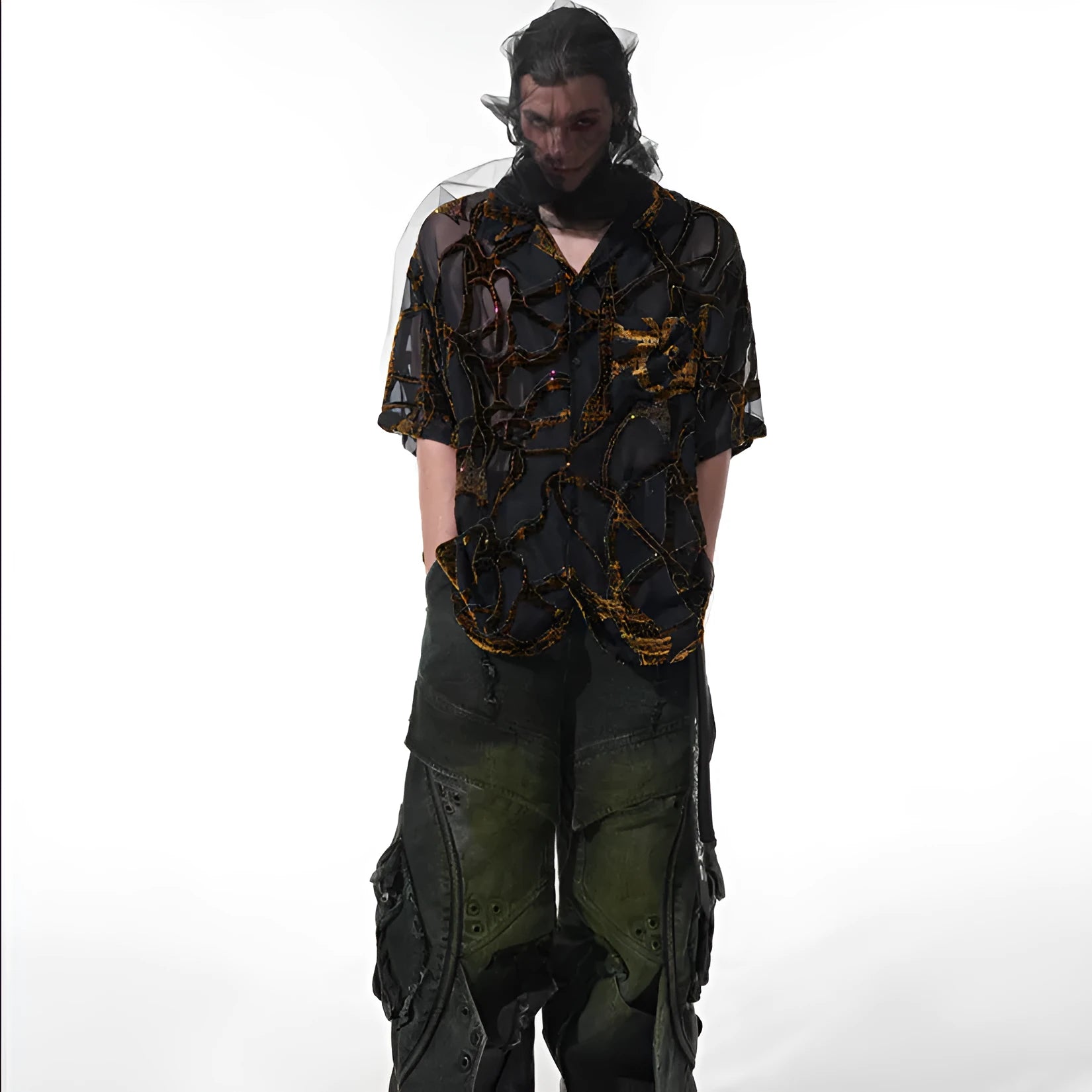 Man's black and grey snake pattern short-sleeved shirt with loose fit and lapel collar.