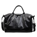 Women's large capacity hand-carry travel bag in black or silver with 36-55 litre capacity