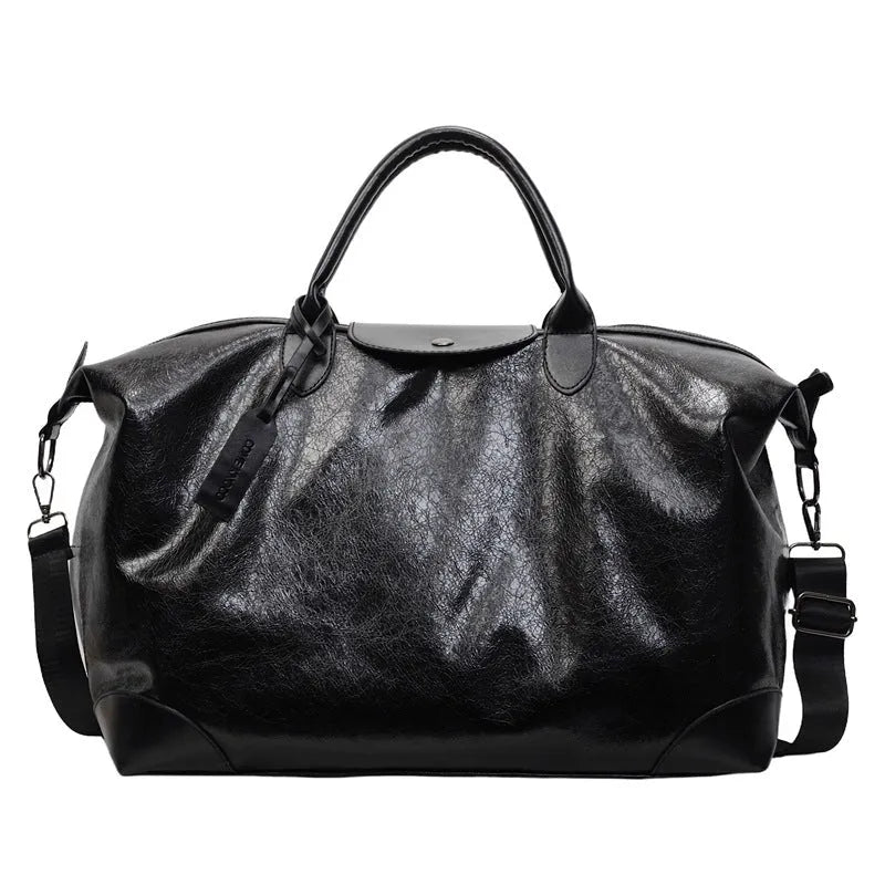 Women's large capacity hand-carry travel bag in black or silver with 36-55 litre capacity