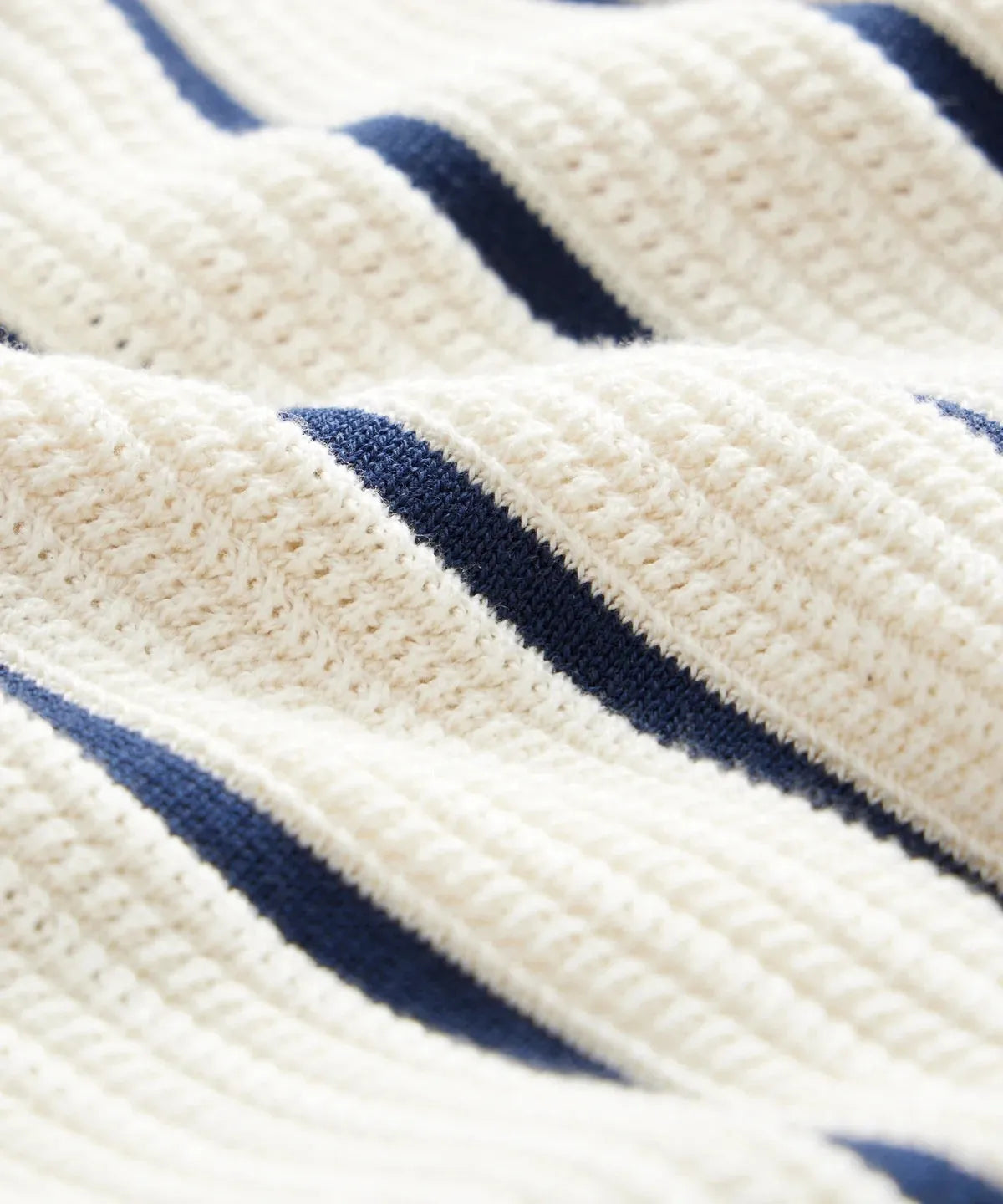 Men's white short sleeve knitted top with lapel collar and asymmetric design.