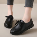 Women's black flat work shoes with microfiber upper, round toe, front lacing and anti-slip polyurethane sole