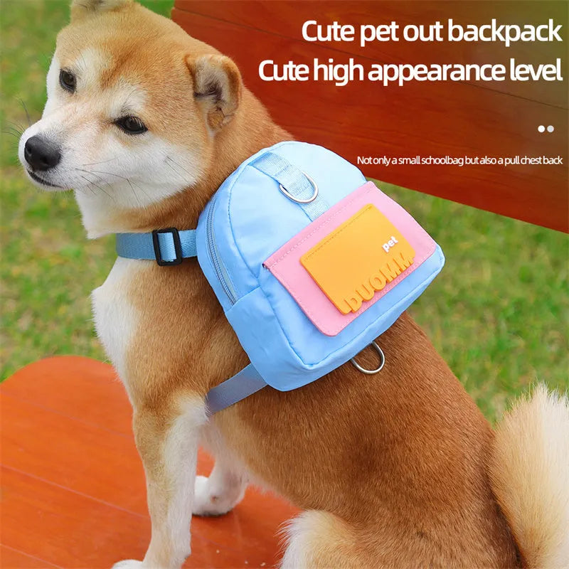 Blue adjustable dog harness backpack with breathable mesh panels and a tow rope attached.