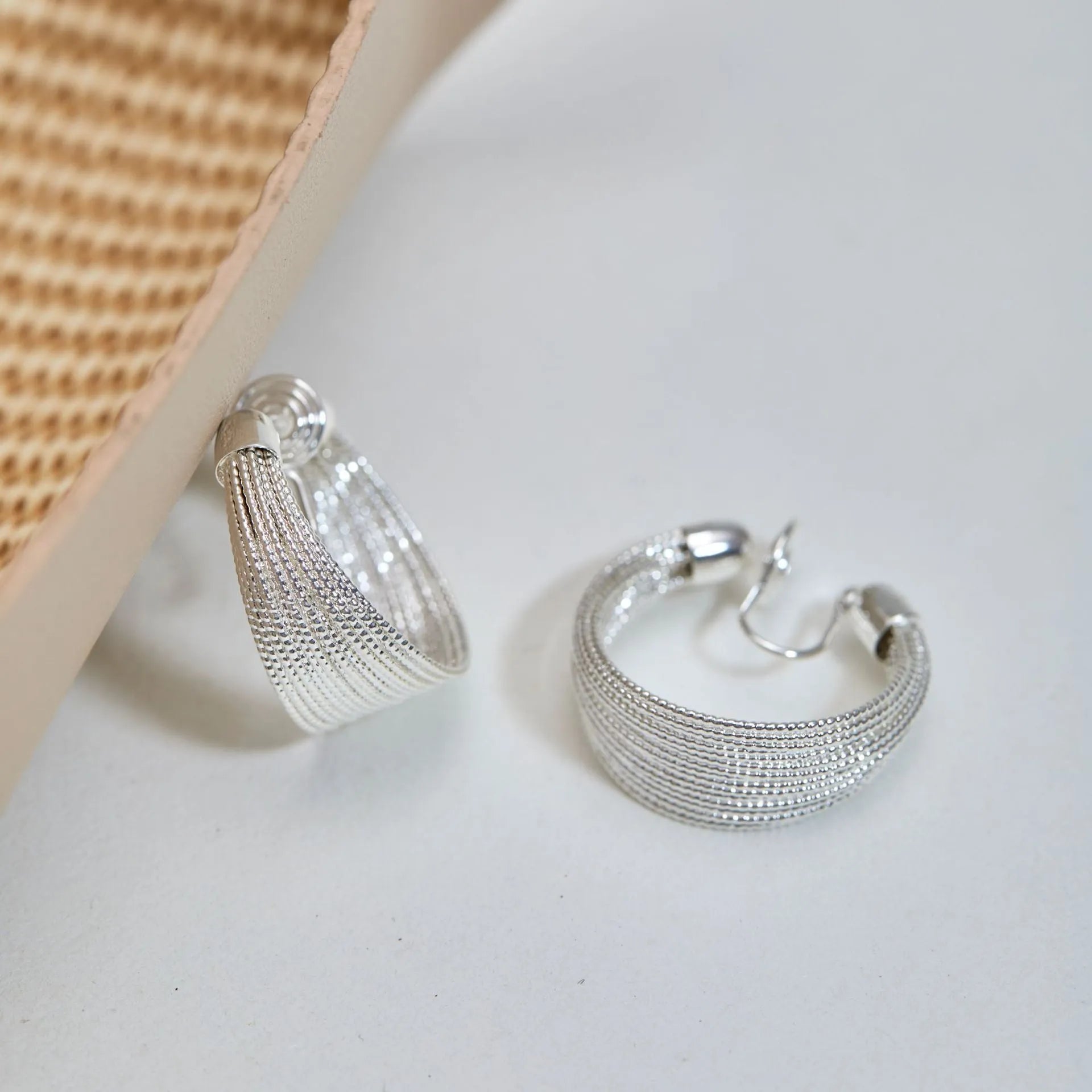 Geometric multi-layer copper earrings with stud and clip options in silver and gold finishes
