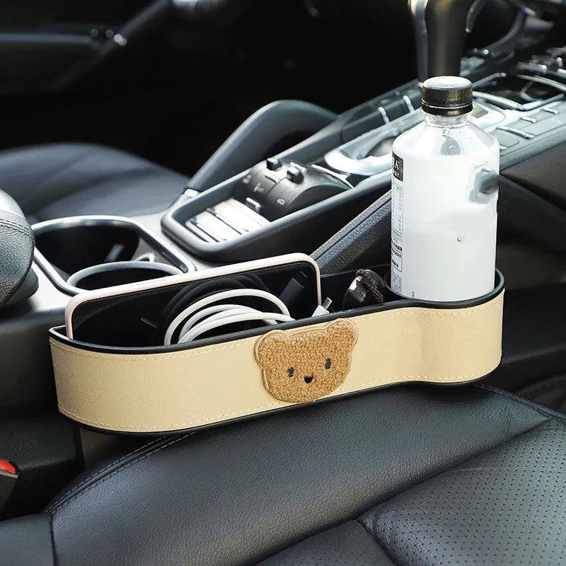 Car seat gap storage box with cartoon bear design made from leather