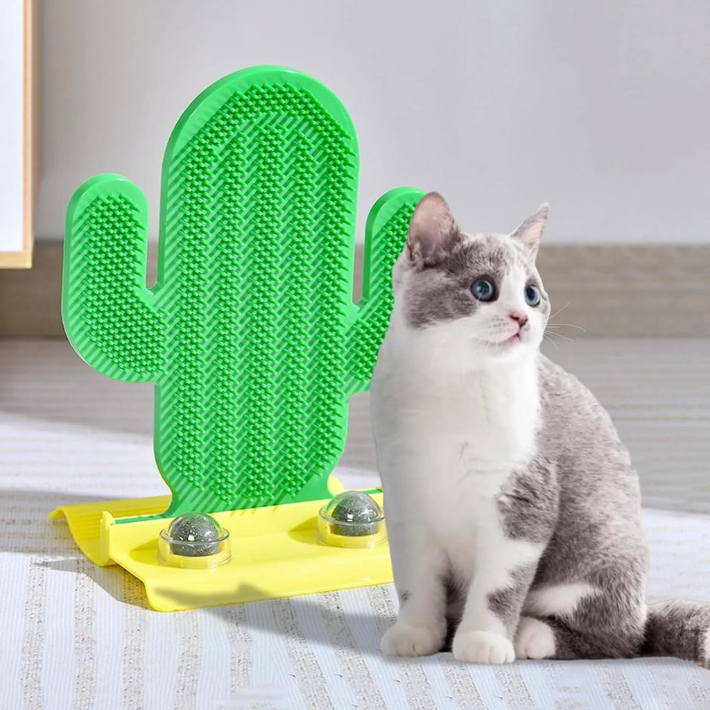Green cactus-shaped cat self groomer with two catnip balls attached to a wall corner