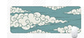 Large cloud pattern desk mat with natural rubber non-slip base on a wooden desk