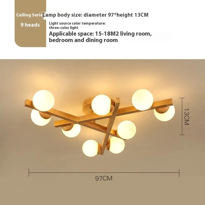 Wooden style modern Nordic ceiling light with three heads, installed in a living room.