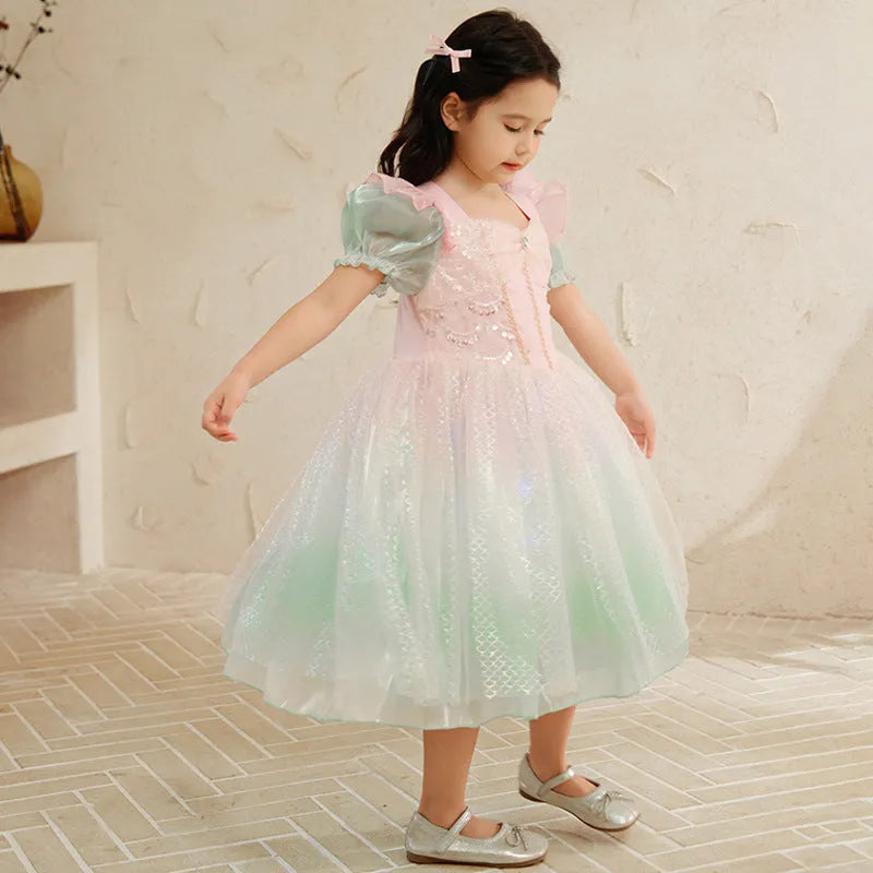 Little girl wearing a puff sleeve mermaid princess dress in cotton fabric, solid colour style, suitable for party or wedding