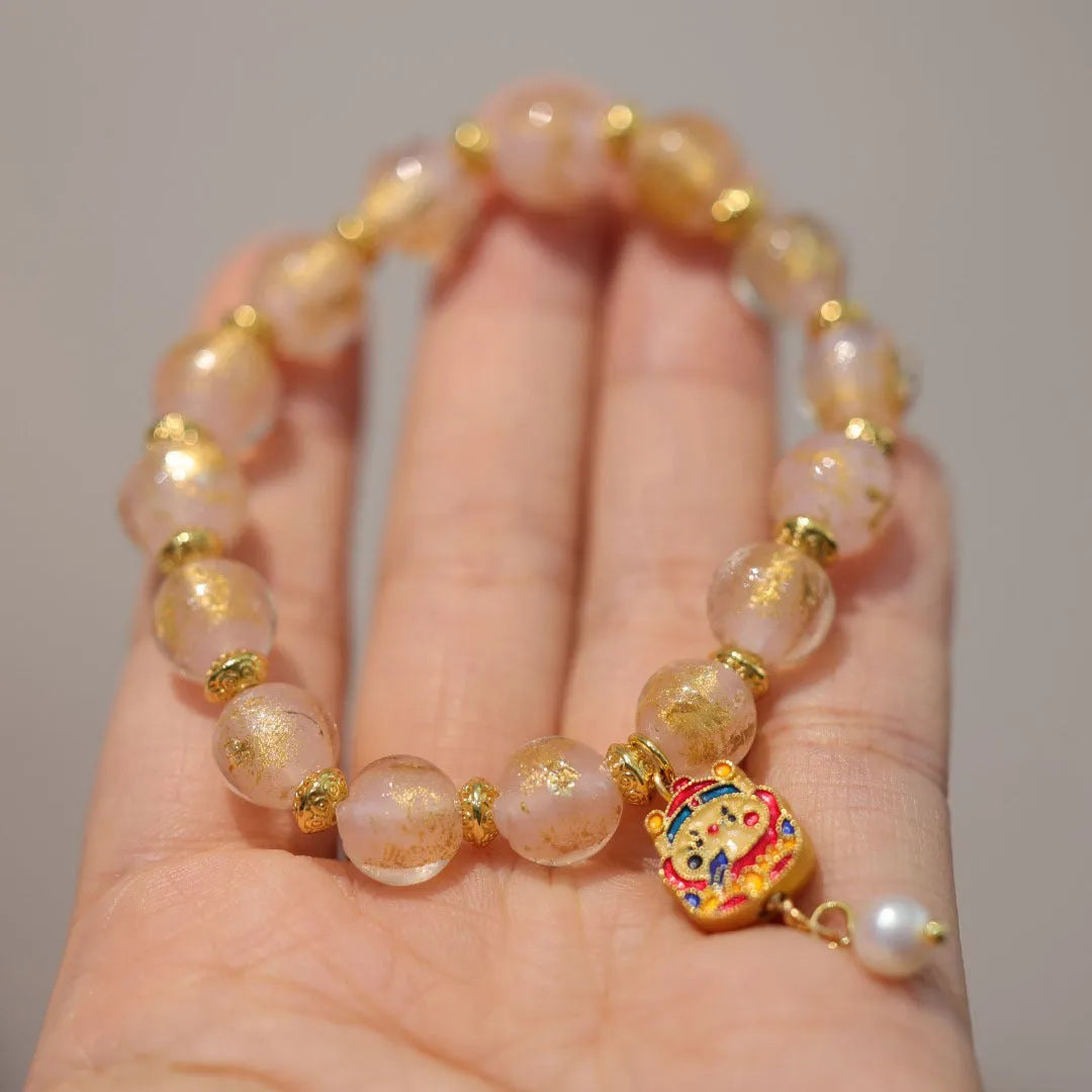 Gold foil coloured glaze ethnic bracelet for women with geometric design and Xingshi elements
